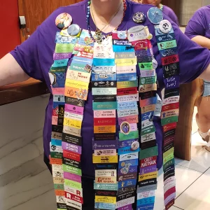 Epic Badge Ribbons on Hotel Employee at Dragon Con 2024