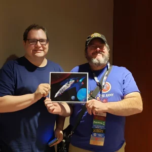 Wes and Soban with YSS Resurgence Sign at Dragon Con 2024