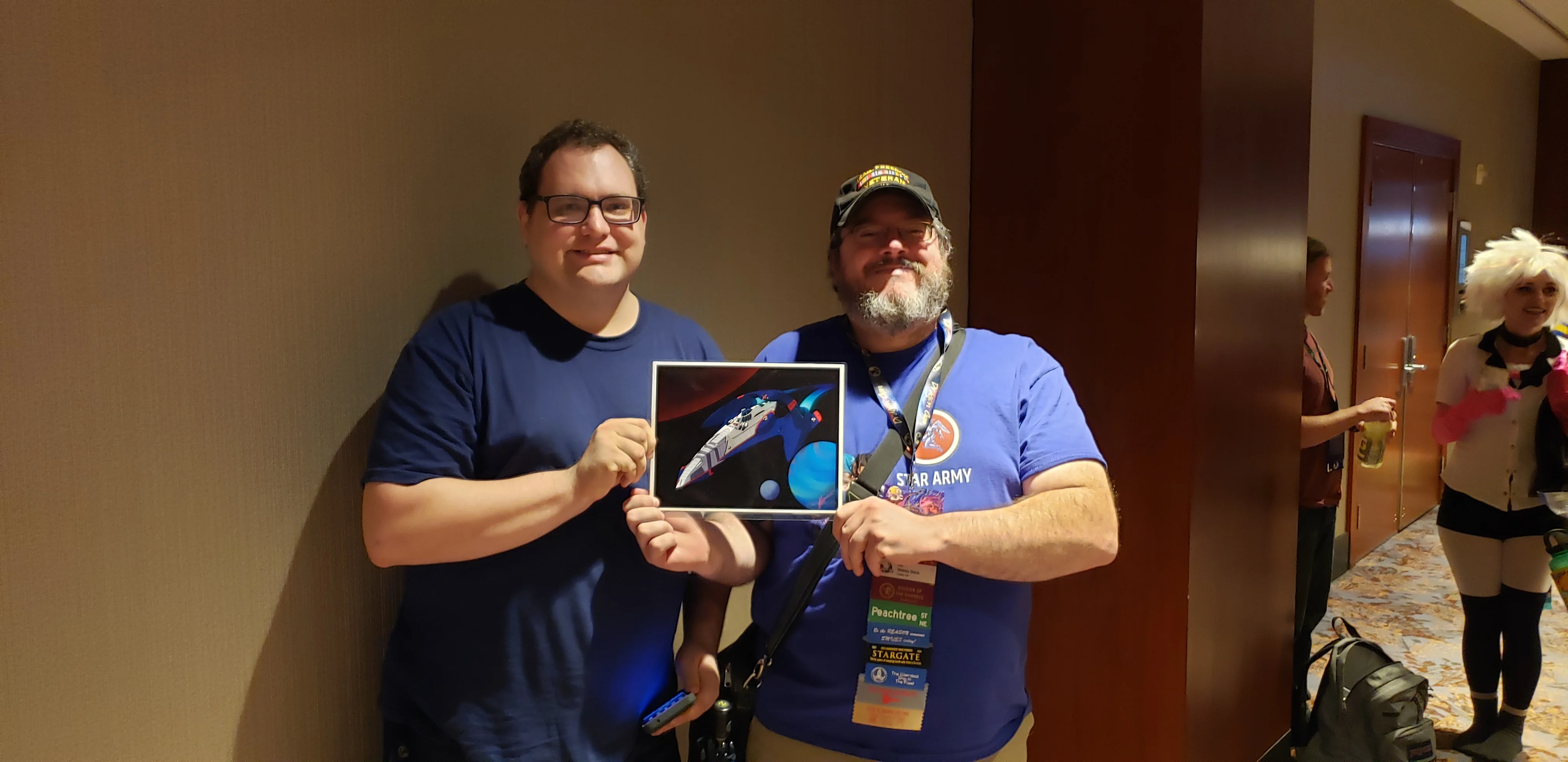 Wes and Soban with YSS Resurgence Sign at Dragon Con 2024